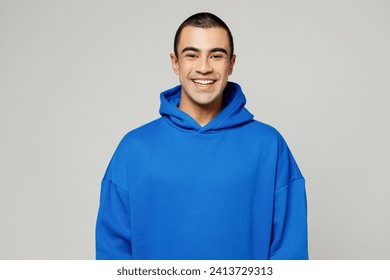 Young smiling cool fun happy cheerful satisfied positive middle eastern man he wear blue hoody casual clothes look camera isolated on plain solid white background studio portrait. Lifestyle concept - Powered by Shutterstock