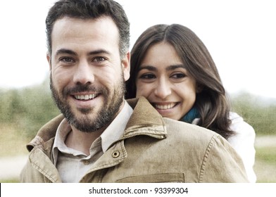 Young smiling couple embraced