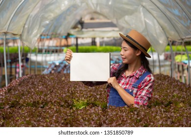 The young smiling farmer stood empty white paper.