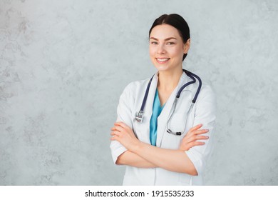 Young smiling female doctor with stethoscope and folder. caucasian brunette - Powered by Shutterstock