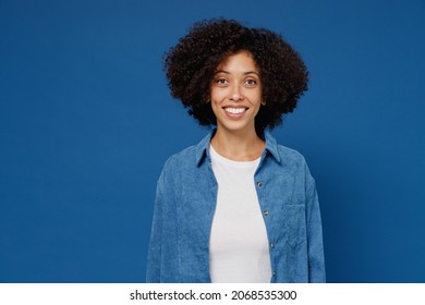 Young Smiling Friendly Cheerful Satisfied Happy Black Woman In Casual Clothes Shirt White T-shirt Looking Camera Isolated On Plain Dark Blue Color Background Studio Portrait. People Lifestyle Concept