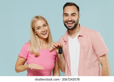 Young Smiling Happy Couple Two Friends Family Man Woman 20s In Casual Clothes Together Holding Showing Car Key Isolated On Pastel Plain Light Blue Background Studio Portrait People Lifestyle Concept