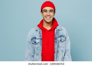 Young smiling happy fun joyful cool satisfied middle eastern man 20s he wear denim jacket red hat looking camera isolated on plain pastel light blue cyan background studio. People lifestyle concept - Powered by Shutterstock