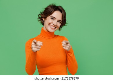 Young smiling happy leader cool fun woman 20s wear casual orange turtleneck point index finger camera on you say do it motivate isolated on plain pastel light green color background studio portrait - Shutterstock ID 2172379279