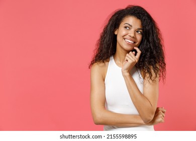 Young smiling happy thoughtful wistful dreamful friendly african american woman 20s wear casual white tank shirt looking aside prop up chin isolated on pink color background. People lifestyle concept. - Powered by Shutterstock