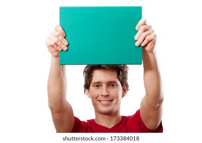 Young smiling man in red t-shirt showing you space for your own text