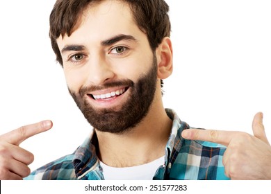 Young Smiling Man Showing His Perfect Teeth.