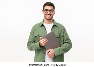 Young Smiling Modern Male Teacher Holding Laptop, Isolated On Gray Background