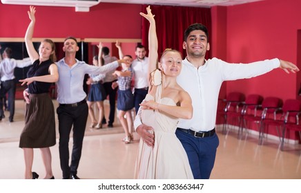 Young Smiling People Practicing Passionate Samba In Dance Class