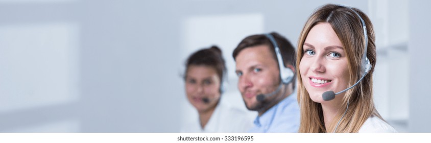 Young smiling people are working at telemarketing - Shutterstock ID 333196595