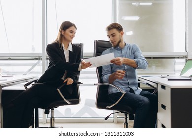 Young Smiling Personal Assistant Giving Document To Office Worker In His Office, Female Accountant Reporting Great Work To Ceo, Junior Manager Showing To Executive Increased Financials