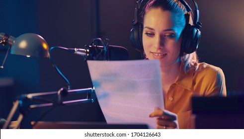 Young Smiling Radio Presenter Talking Into The Microphone And Reading News, Radio Broadcast Concept