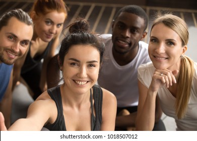 Young Smiling Sporty Multiracial Friends Taking Group Selfie Photo Holding Looking At Camera, Happy Healthy Diverse Fit People Making Self-portrait After Working Out Together In Gym, View From Camera