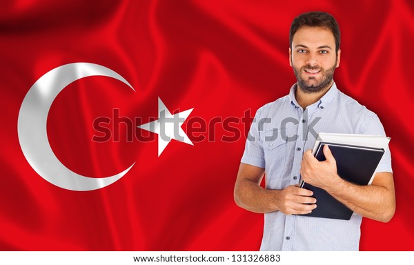 Young smiling\
student learns the turkish\
language