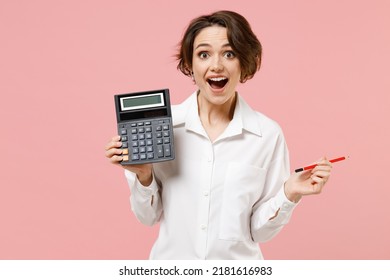 Young smiling successful employee business secretary woman corporate lawyer in classic formal white shirt work in office hold in hands calculator isolated on pastel pink background studio portrait. - Shutterstock ID 2181616983