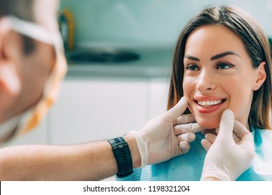 Young smiling woman with beautifiul teeth, having a dental inspection - Shutterstock ID 1198321204