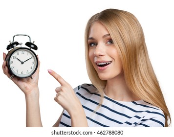 Young Smiling Woman Holds Black Clock