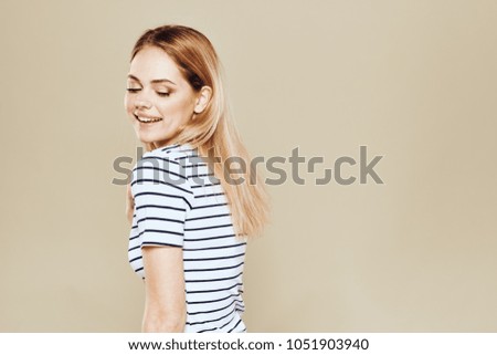   young smiling woman looking down                             