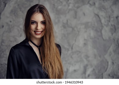 Young Smiling Woman Looking Straight Forward. Photo With Place For Text.