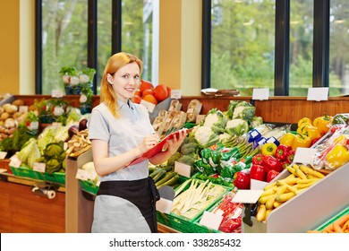 Young Smiling Woman Making Training For Retail Salesperson In A Supermarket