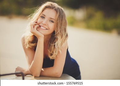 Young Smiling Woman Outdoors Portrait. Soft Sunny Colors.Close Portrait.