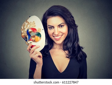 Young Smiling Woman With Sad Carnival Mask