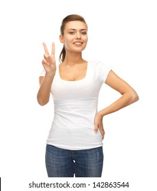 Young Smiling Woman Showing Victory Or Peace Sign
