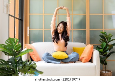 Young Smiling Women Chill  Relax Raise Arm After Working And Meeting At Home.  Lifestyle Freelance Happy And Drinking Coffee In Luxury Living Room In Vacation Holiday And Summer Day.  Lifestyle