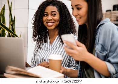 Young Smiling Women Working At Laptop In Office. Business Concept