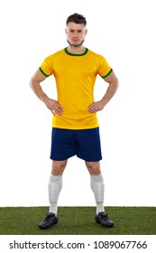 Young soccer fan with yellow and green shirt on white background