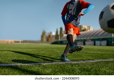 Young soccer goalie starting game kicking ball from white goal line - Powered by Shutterstock