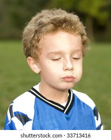 Young Soccer Player Eating Snack During Halftime