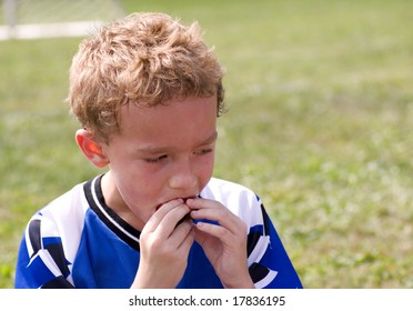 Young Soccer Player Enjoying Halftime Snack