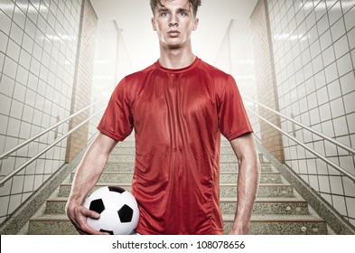 Young soccer player in gray tunnel