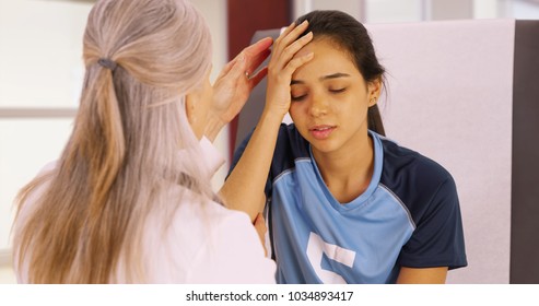 A Young Soccer Player With A Head Injury Recieves Medical Attention