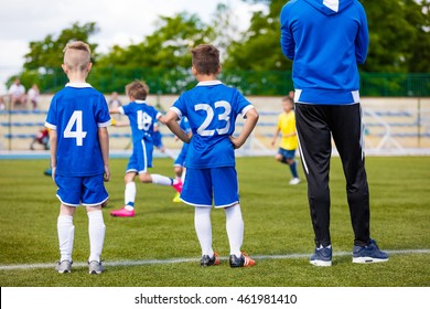 Young Soccer Players With Football Coach. Soccer Tournament For Youth School Sports Teams.