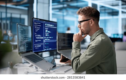 Young Software Engineer Coding On Laptop To Build Secure Business Platform.