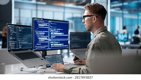 Young Software Engineer Coding On Laptop To Build Secure Business Platform.