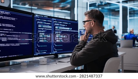 Young Software Engineer Coding Secure Business Platform At Modern Office Desk.