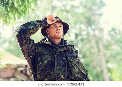 Young Soldier Or Ranger In Forest