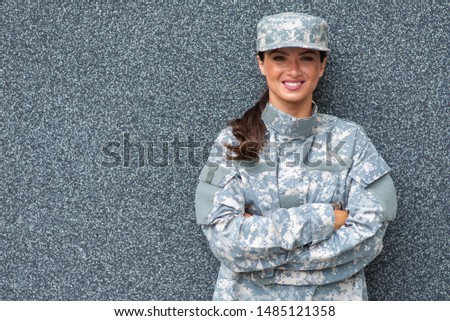 Young Soldier smiling. Portrait of American Woman in the military