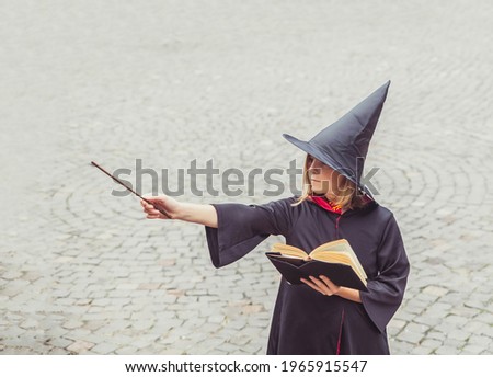 young sorceress in the castle conjuring by magic wand