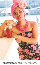 Young South African Zulu Woman Is Sitting Near Bar And Drinking Mojito, Summer Time 