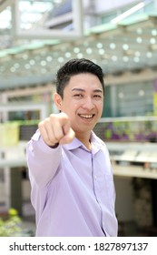 Young South East Asian Man Business Office Outdoor Stand Look At Camera Point Finger Happy