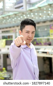 Young South East Asian Man Business Office Outdoor Stand Look At Camera Point Finger Happy