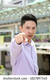 Young South East Asian Man Business Office Outdoor Stand Look At Camera Point Finger Angry