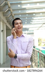 Young South East Asian Middle Eastern Man Business Office Outdoor Stand Talk On Phone