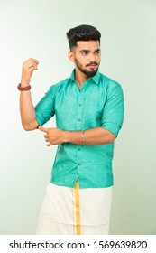 Young South Indian Man In Traditional Dress, Dhoti And Shirt