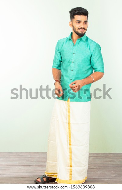 Portrait-of South indian man in-traditional dress standing at-home  on-diwali Festival