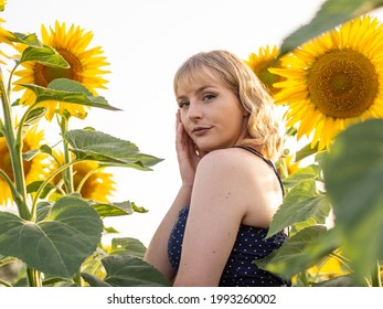 A Young Spanish Woman Posing In The Sunflower Field